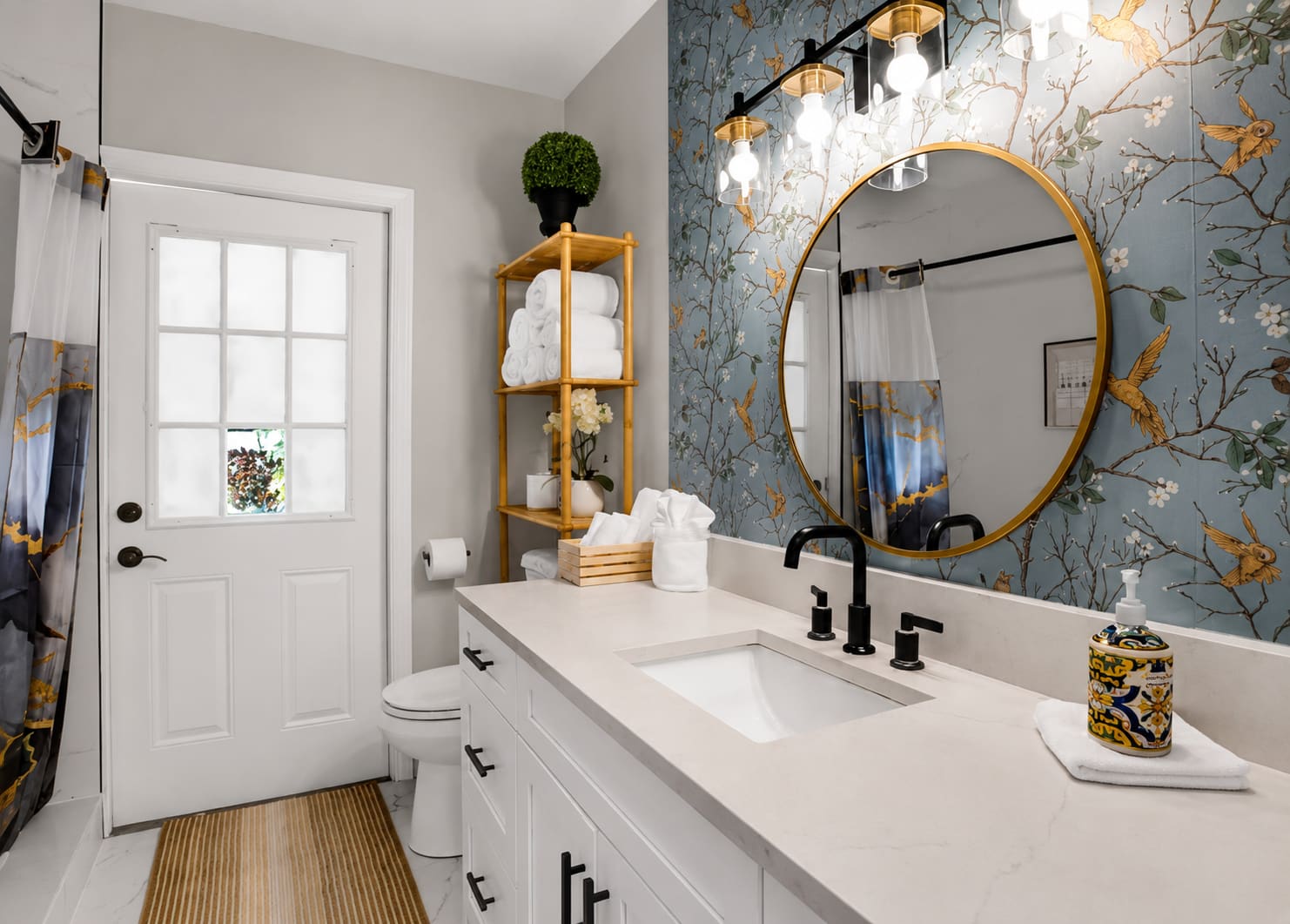 Finished bathroom remodel with modern vanity and round mirror — REV Home Solutions