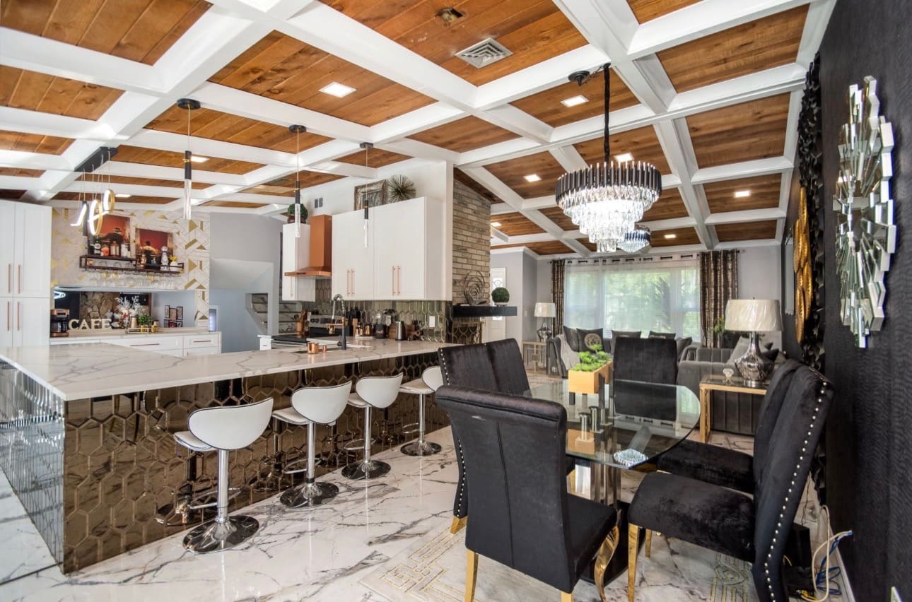 Finished kitchen remodel with mirrored tile bar and marble flooring — REV Home Solutions
