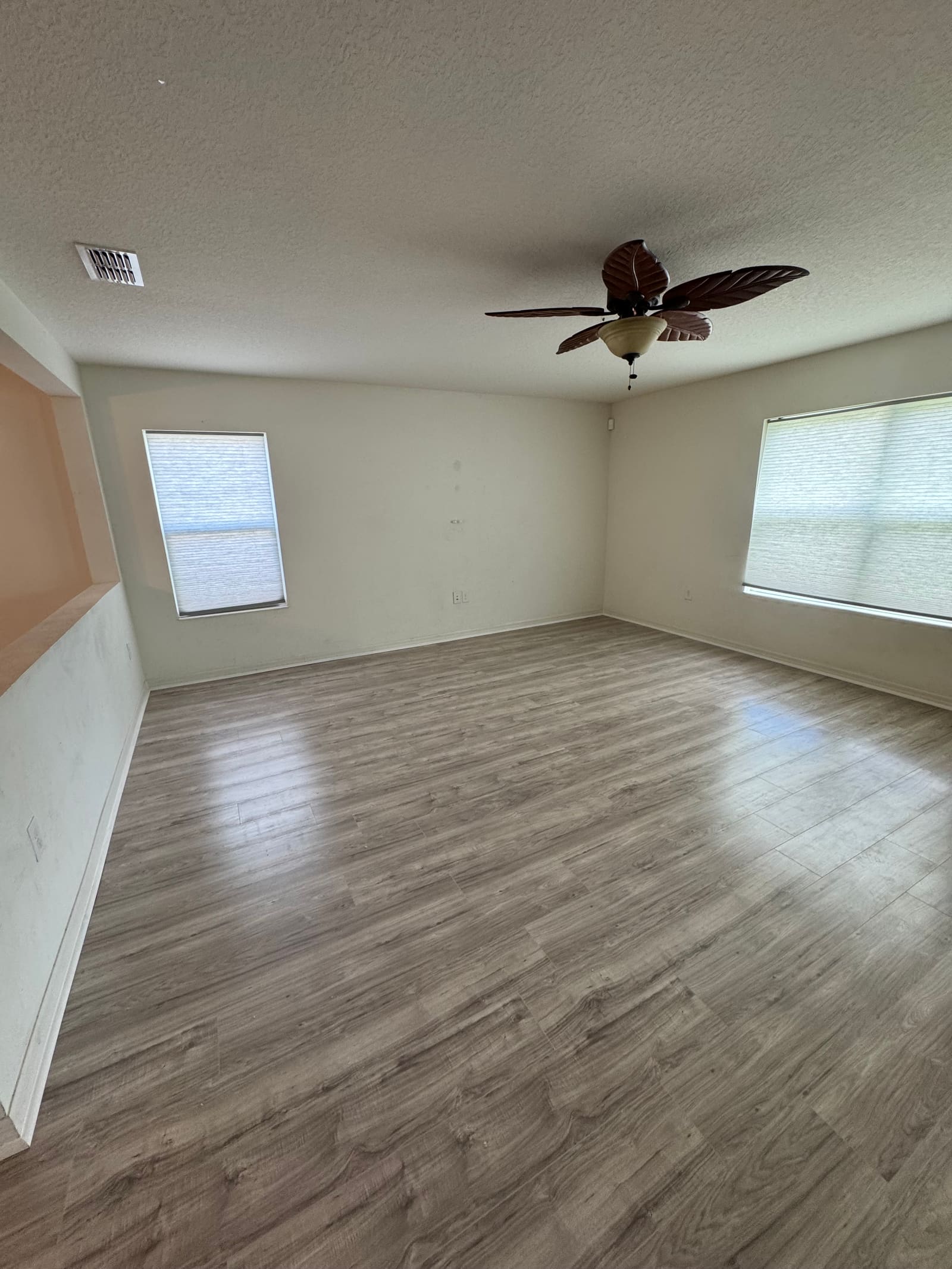 Finished wide-plank wood-look flooring installation — REV Home Solutions