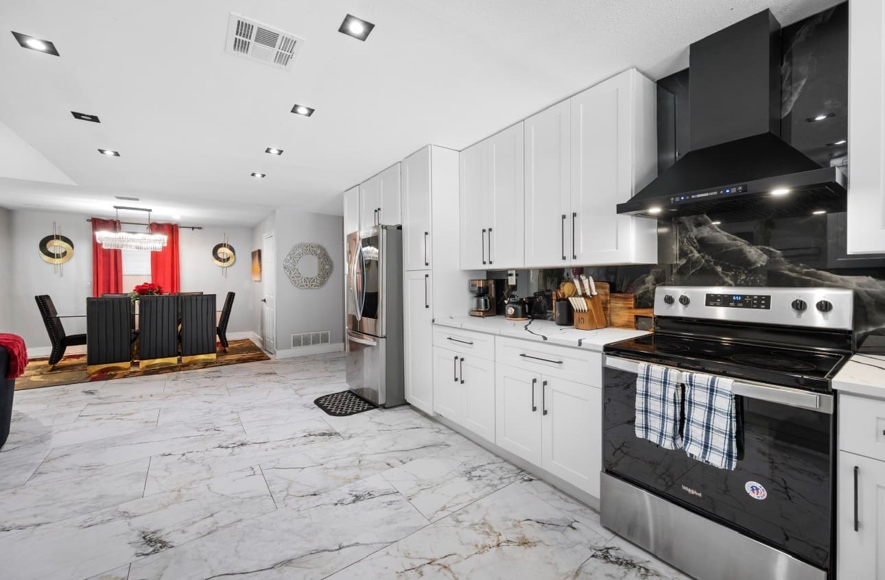 Finished marble-look tile flooring installation — REV Home Solutions