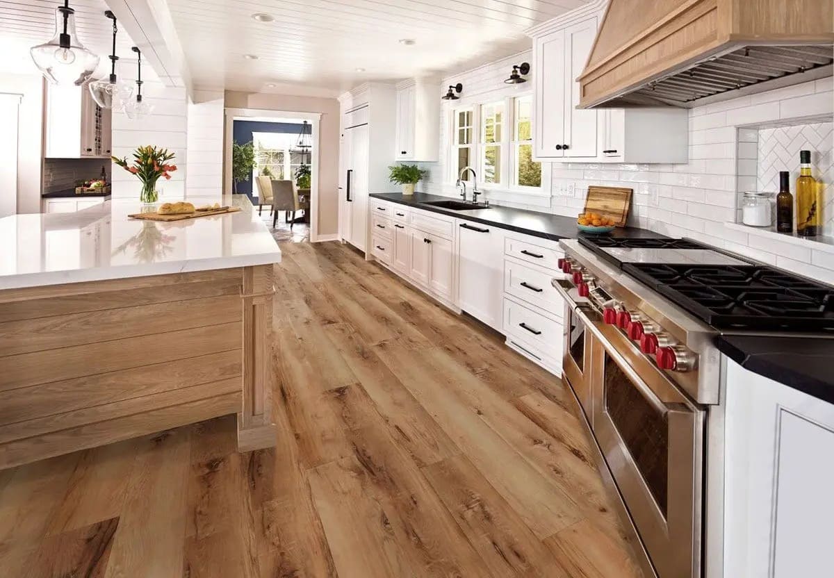 Finished wood-look plank flooring installation — REV Home Solutions
