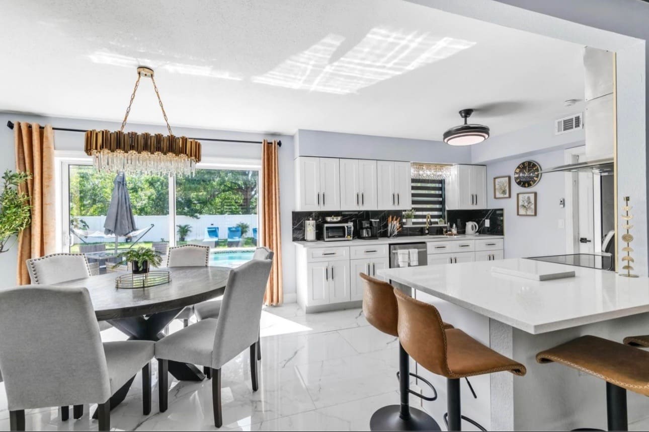 Finished open-concept kitchen, dining and living space — REV Home Solutions